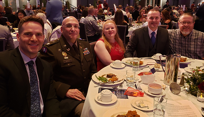 Left to right: Event co-MC Mark Hamahan (KREM 2 Evening News Anchor),  Lt. Col. (ret) Paul Apple, Wendy Freudenberg, Lt. Col. Rich Freudenberg, and Chaplin David Baird.