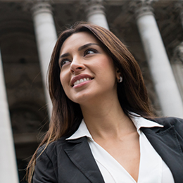 A female attorney outside a couthouse