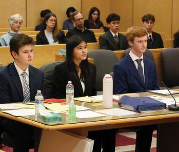 Three teenagers in mock trial
